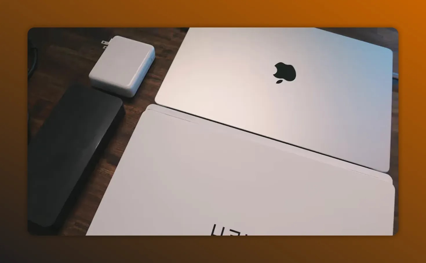 Close-up of the MacBook Pro lid and Apple logo on a desk