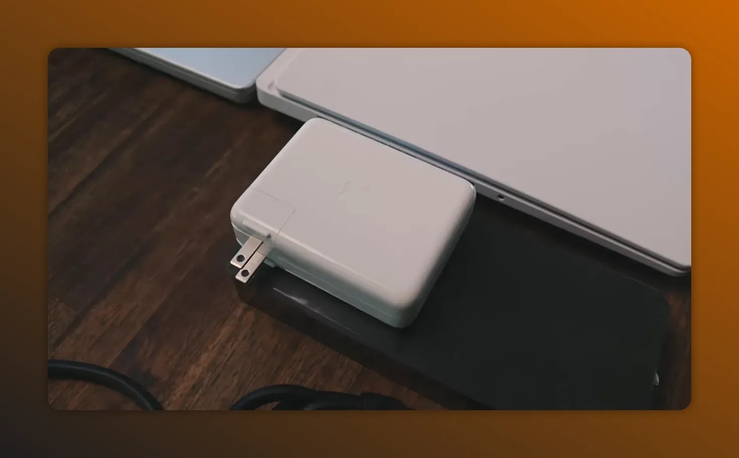 HP Omen-style power brick connected to a laptop on a desk
