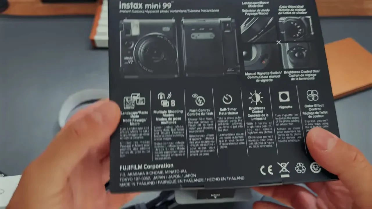Back of Instax Mini 99 box showing feature icons and camera diagrams