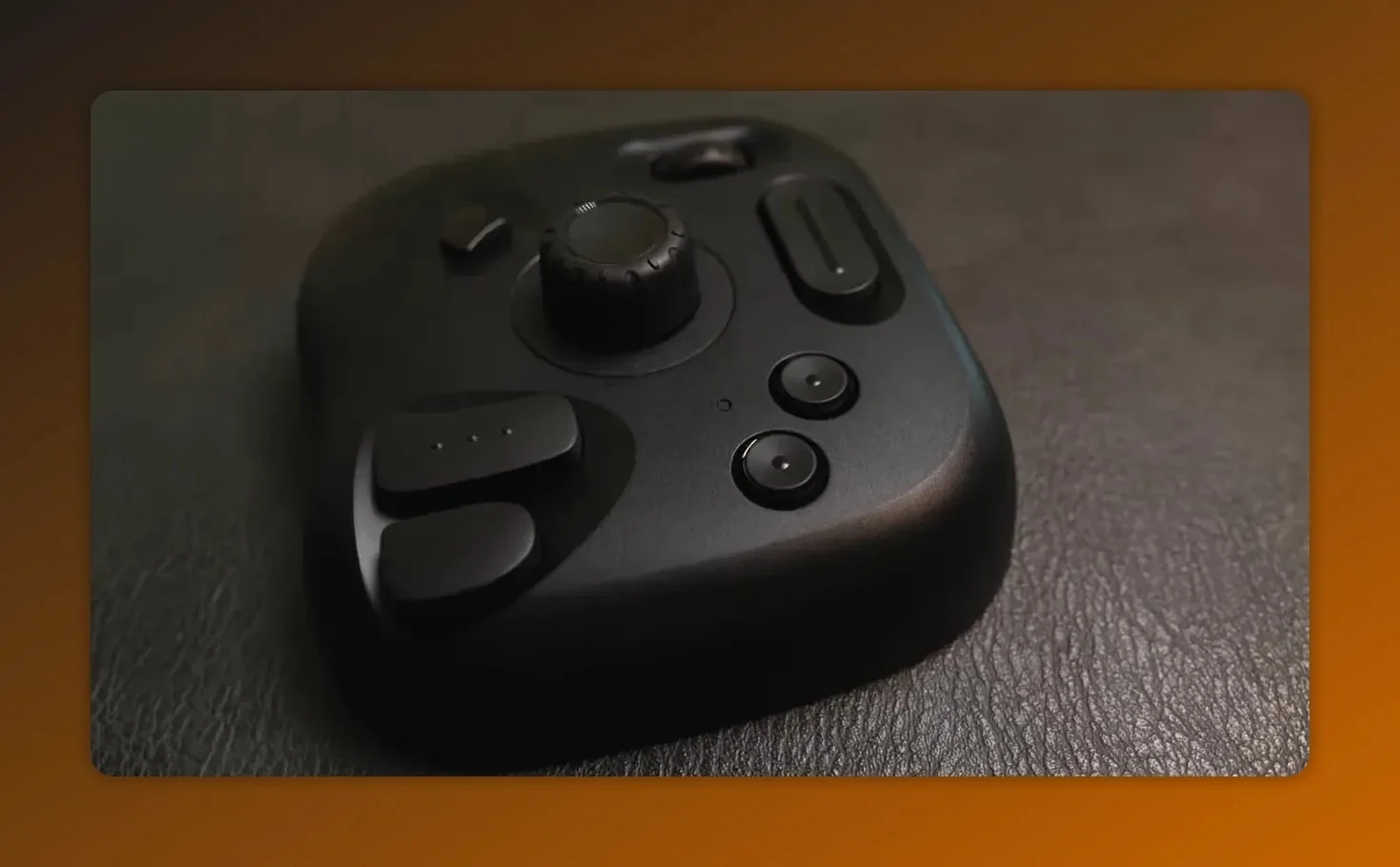 Close-up of the TourBox Lite controller with zoom and action dials visible