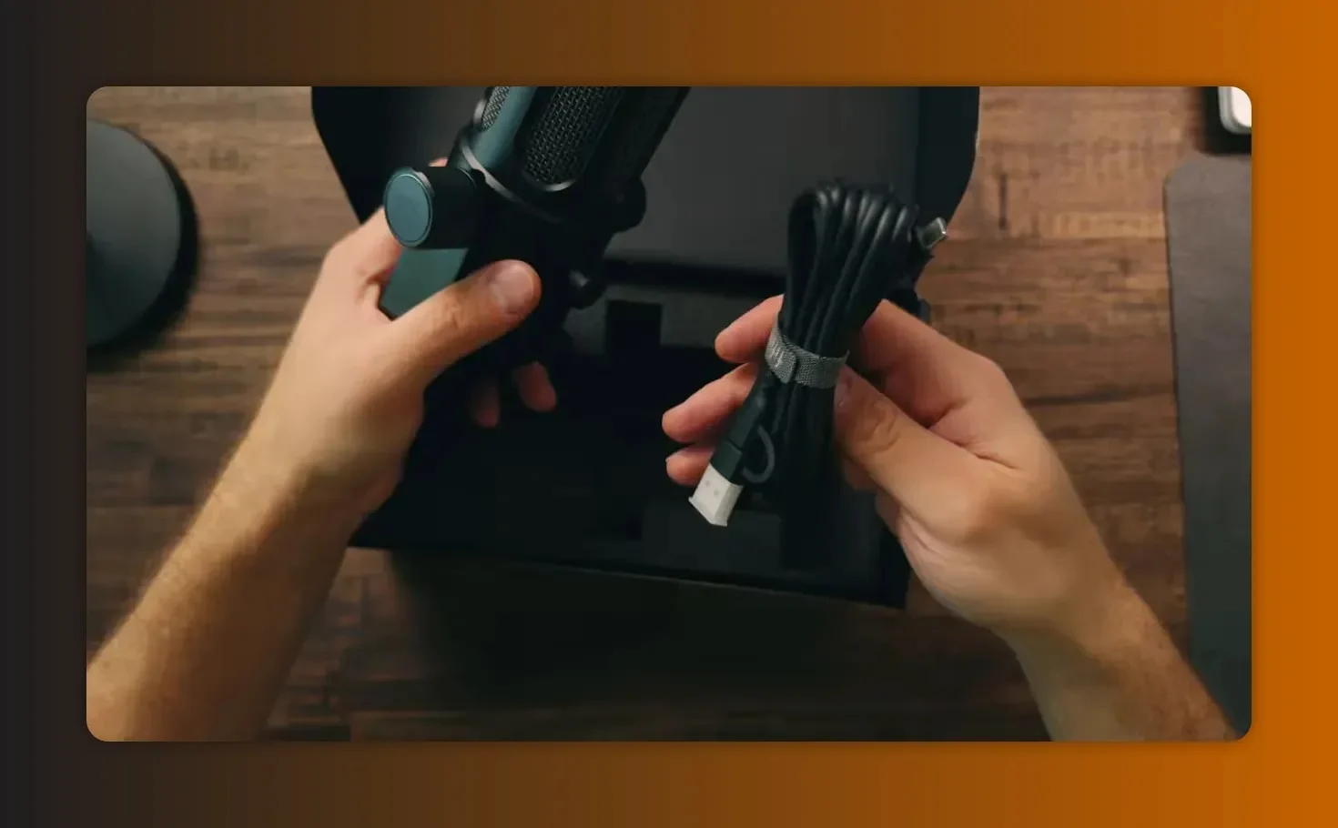 Unboxing the Fifine Tank 6 showing the microphone and the bundled USB cable