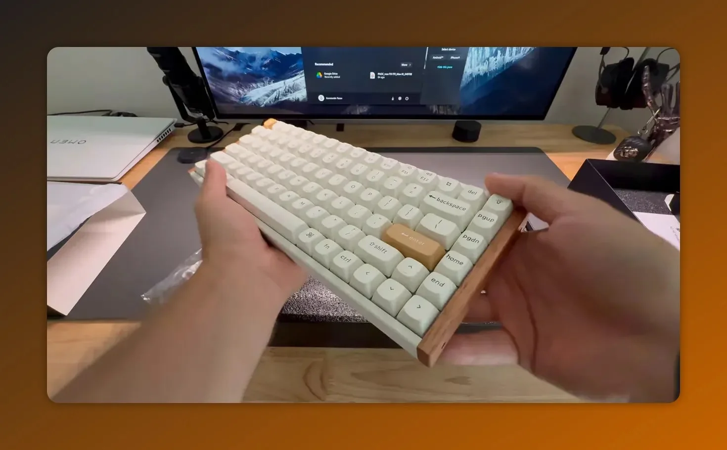 Keychron K2 HE held at an angle showing white keycaps and wooden side panel to highlight build quality