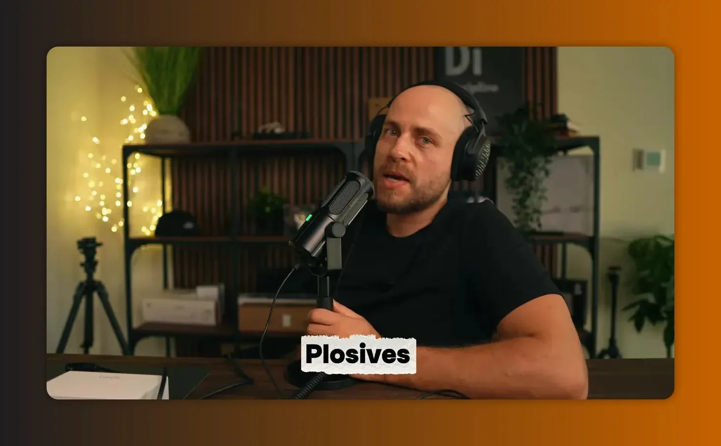 Person close-miking a Fifine Tank 6 microphone demonstrating plosive handling with 'Plosives' text overlay