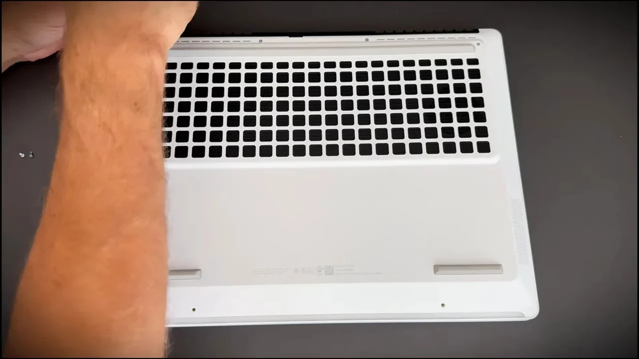 HP Omen Max 16 underside showing ventilation grid and removed screws