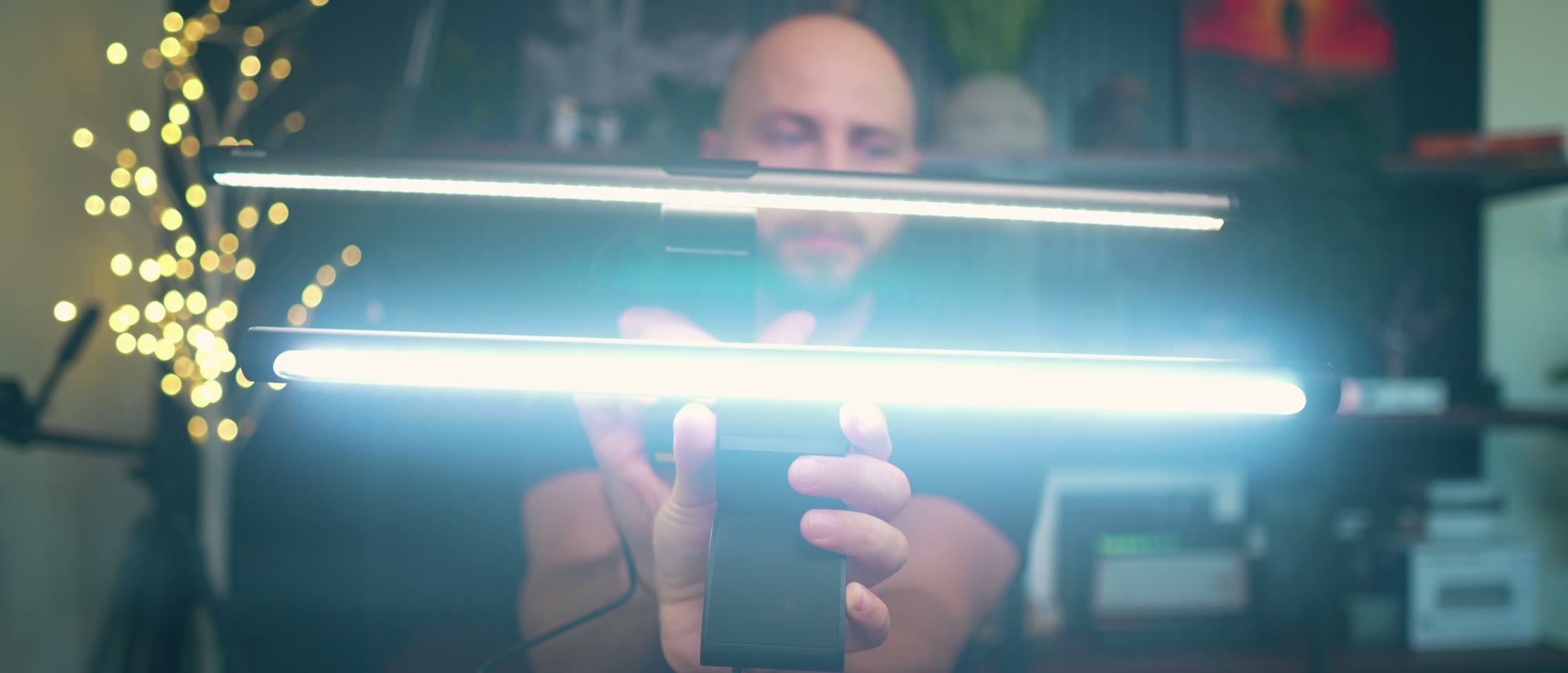 A monitor light bar glowing in the TesovTech studio